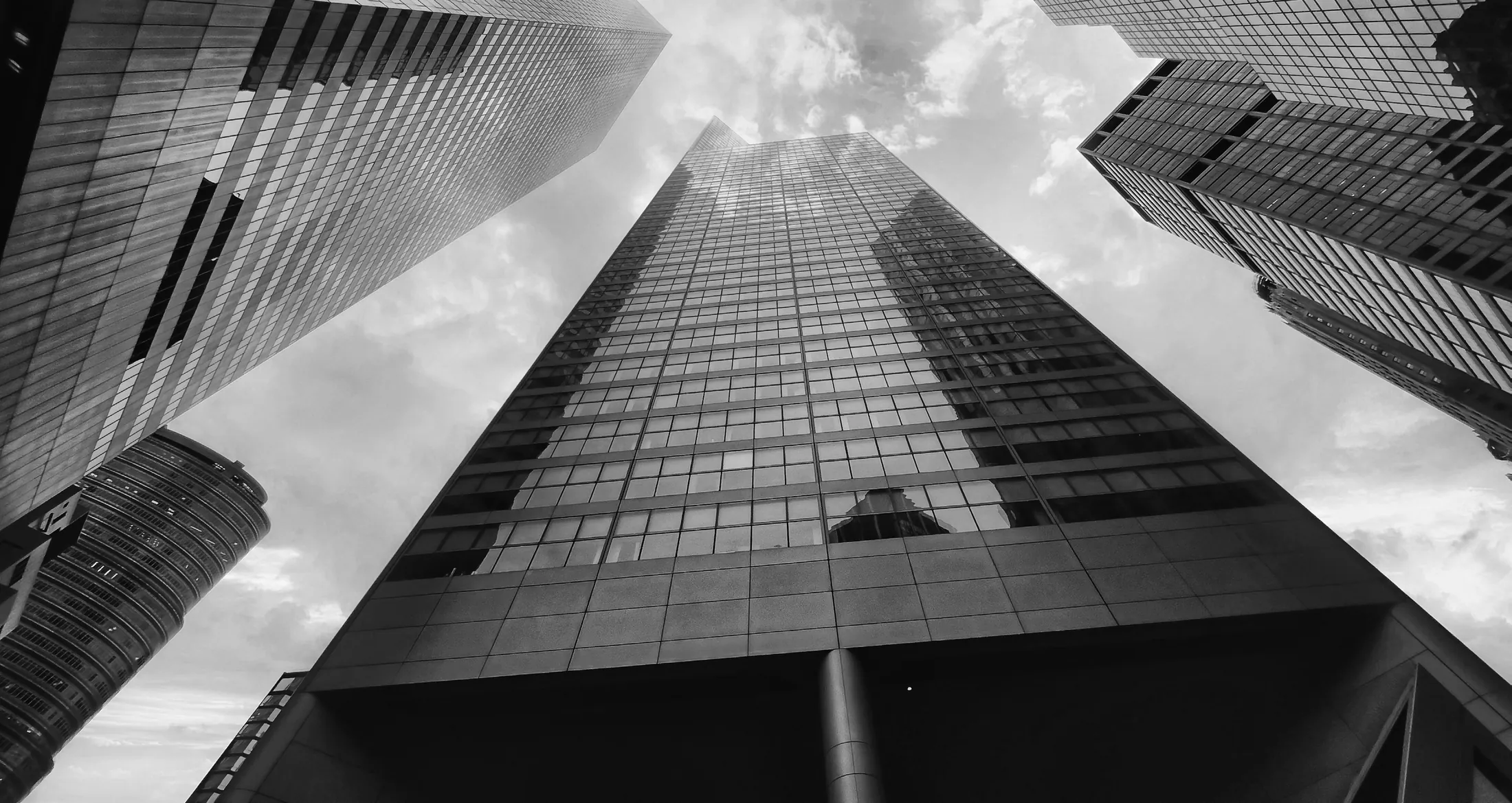 Looking upward between high-rise towers