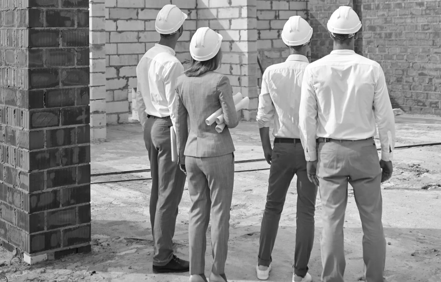 Petals International site team reviewing works on a construction site